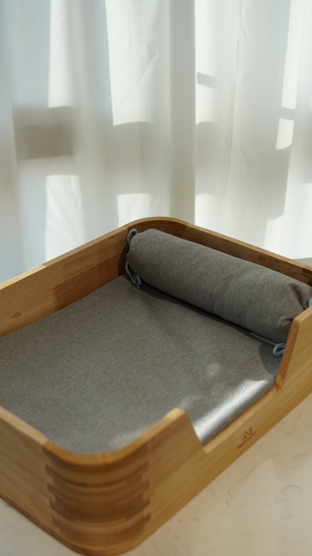 Bamboo Pet Bed - front angle with bolster pillow